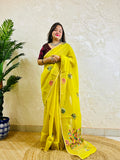 Lemon yellow Parsi Gara handwork Chanderi silk cotton saree with scattered butti florals and multicolour garden border — standing front view, Desi Aadat