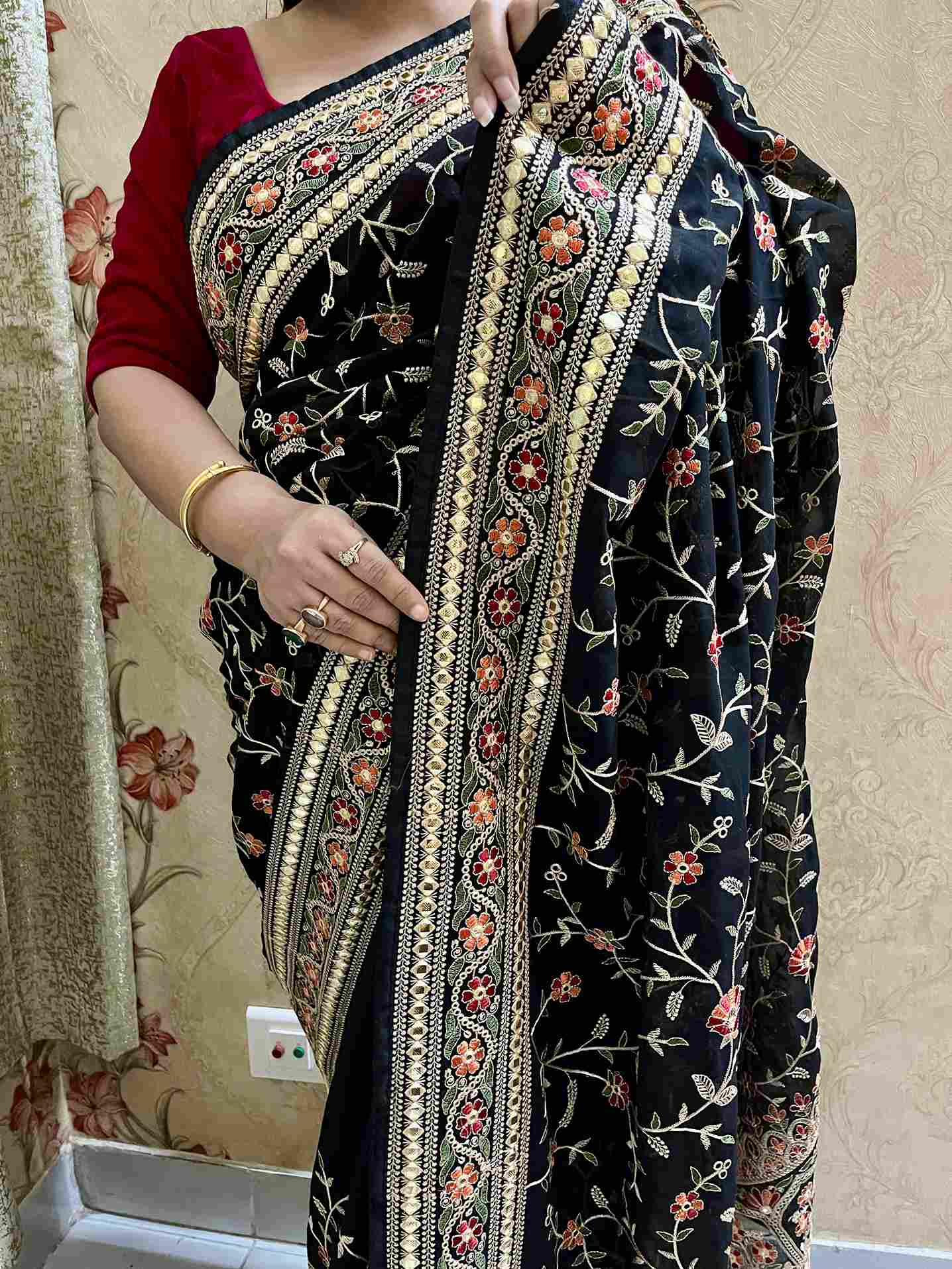 Close-up of Pashmina embroidery on Black georgette saree fabric