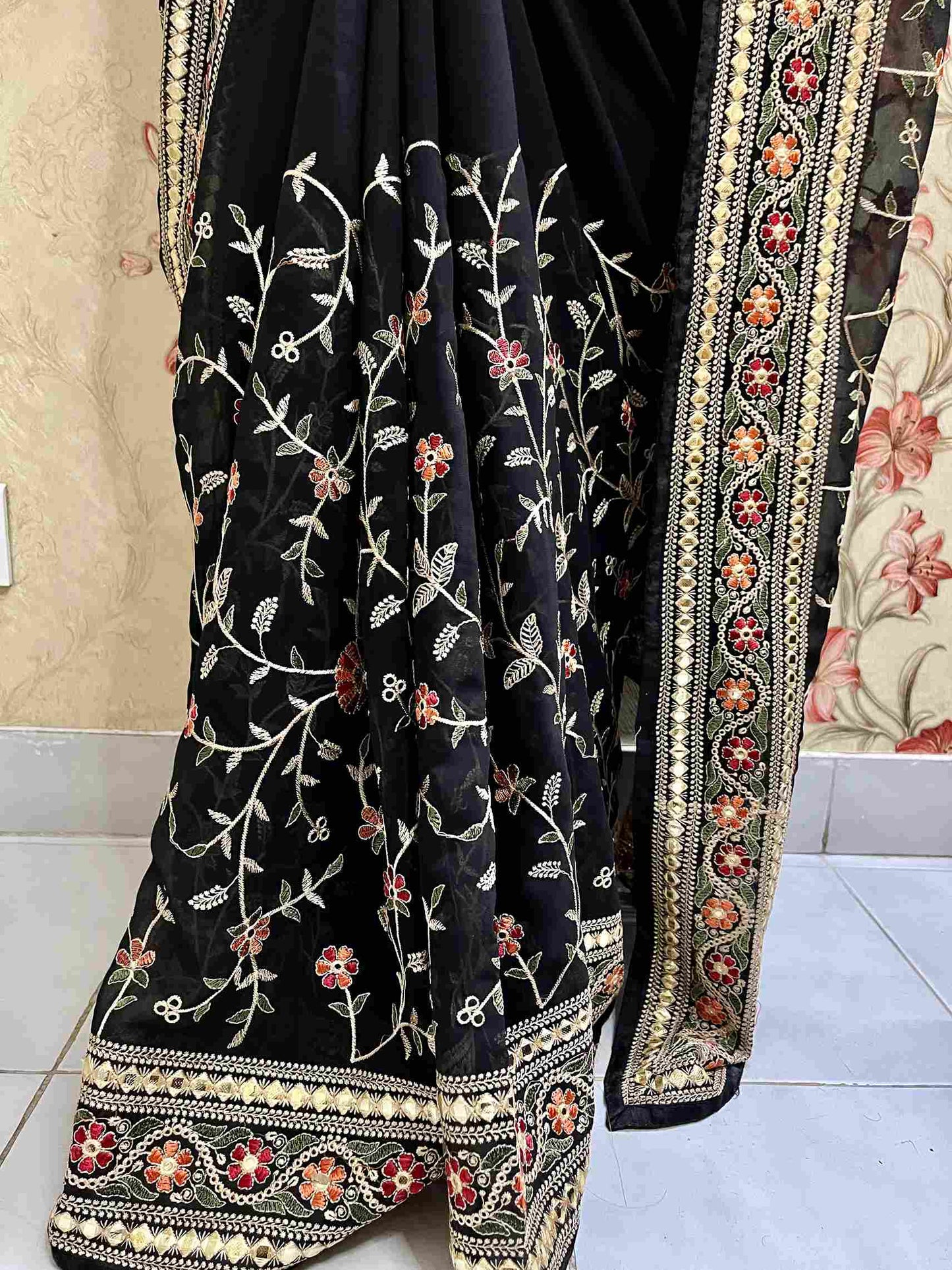 Close-up of Pashmina embroidery on Black georgette saree fabric