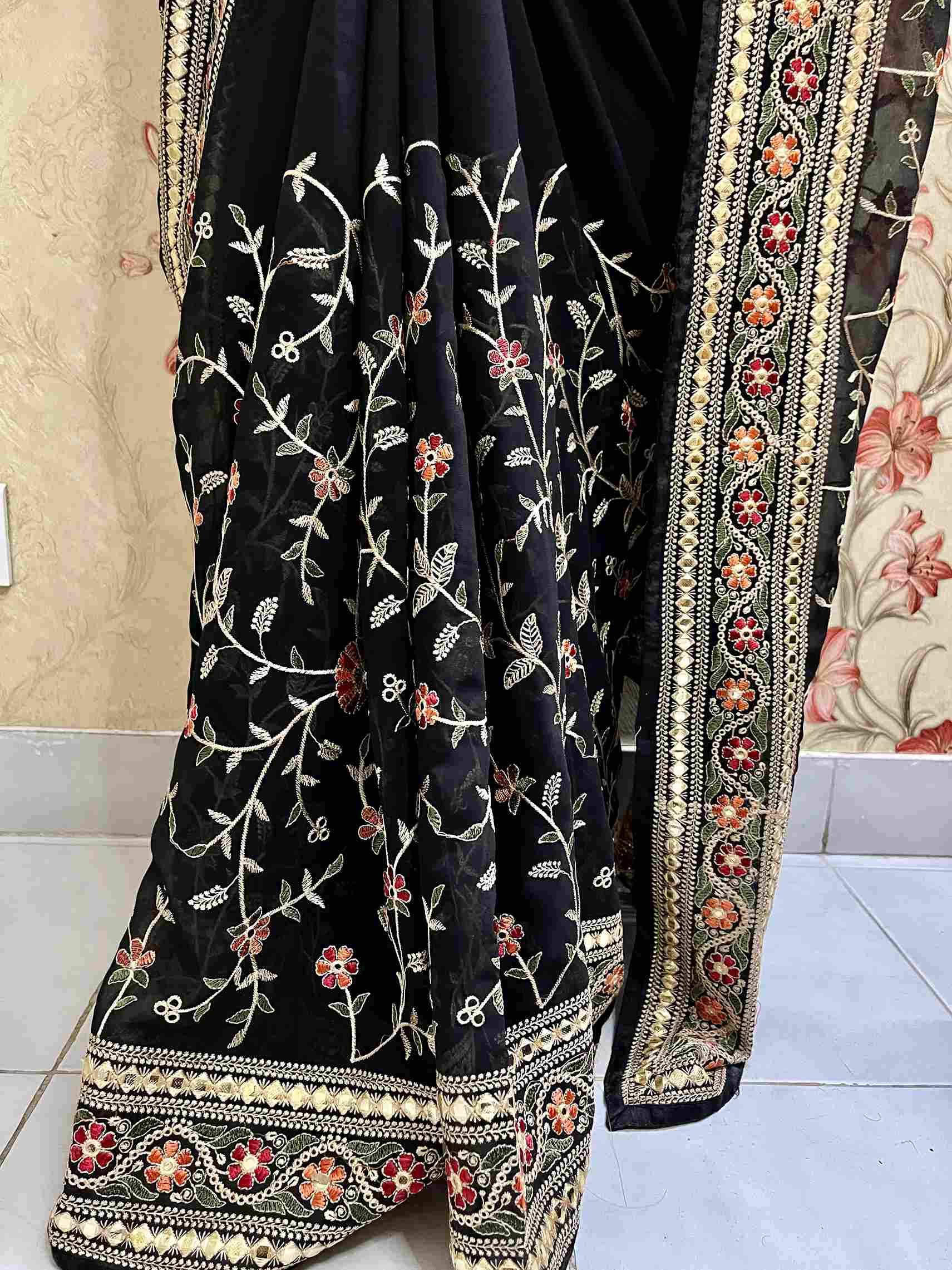 Close-up of Pashmina embroidery on Black georgette saree fabric
