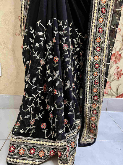 Close-up of Pashmina embroidery on Black georgette saree fabric
