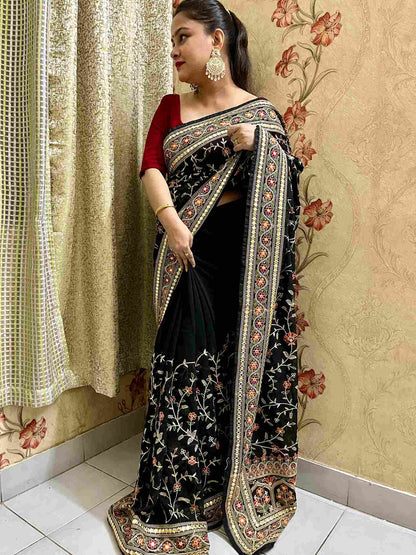 Elegant woman in Black georgette saree showcasing Desi Aadat’s party wear design