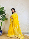 Handmade Lucknowi Chikankari pastel yellow organza silk saree with full jaal embroidery — front standing view, Desi Aadat