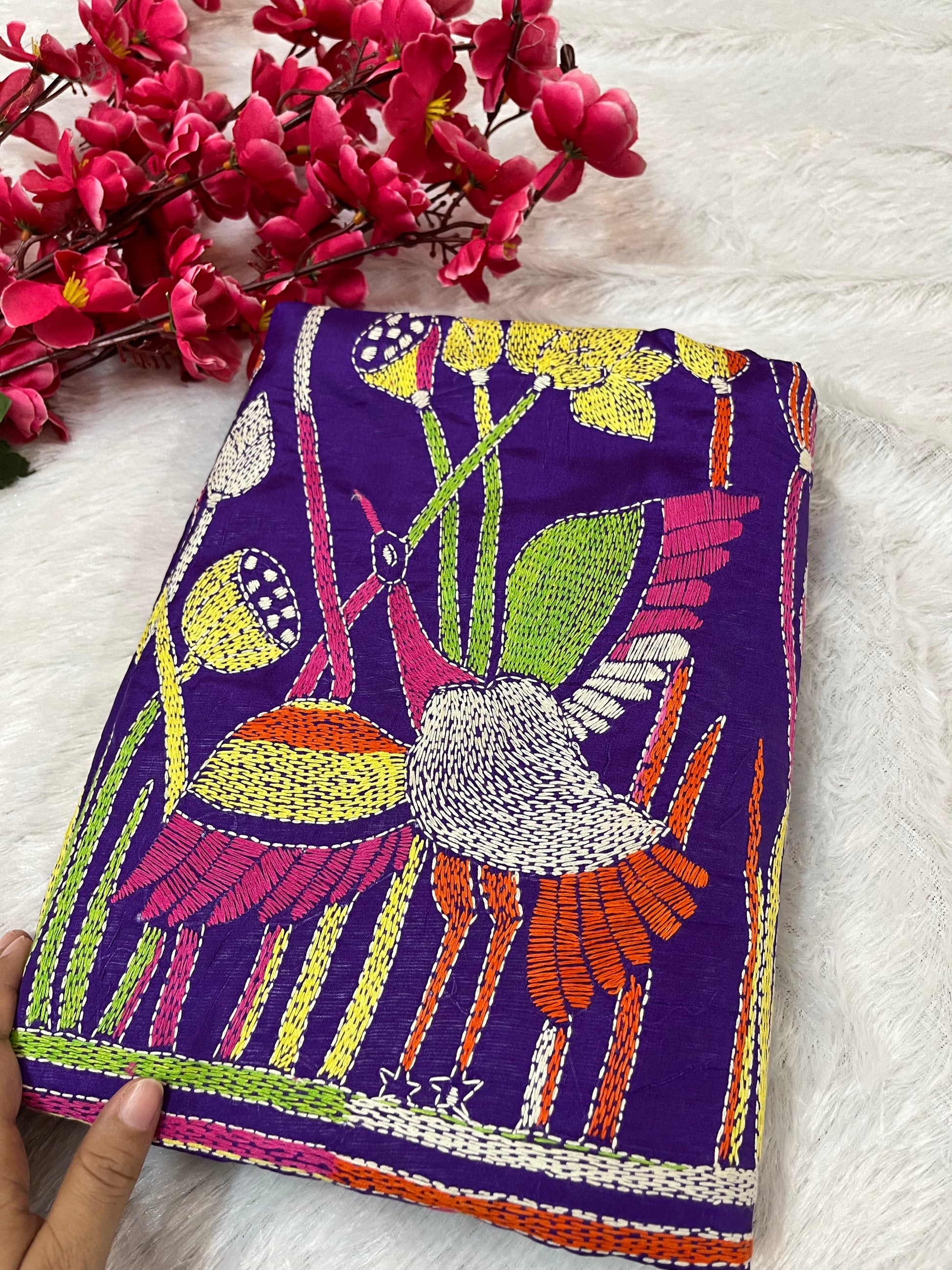 Close-up of bird floral Kantha stitch embroidery on purple Bangalore silk fabric