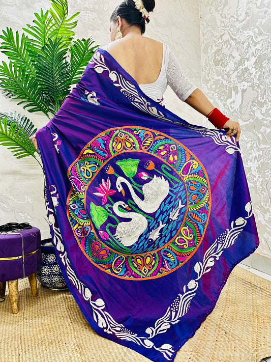 Close-up of swarn golden motif Kantha embroidery on rich purple handwoven fabric