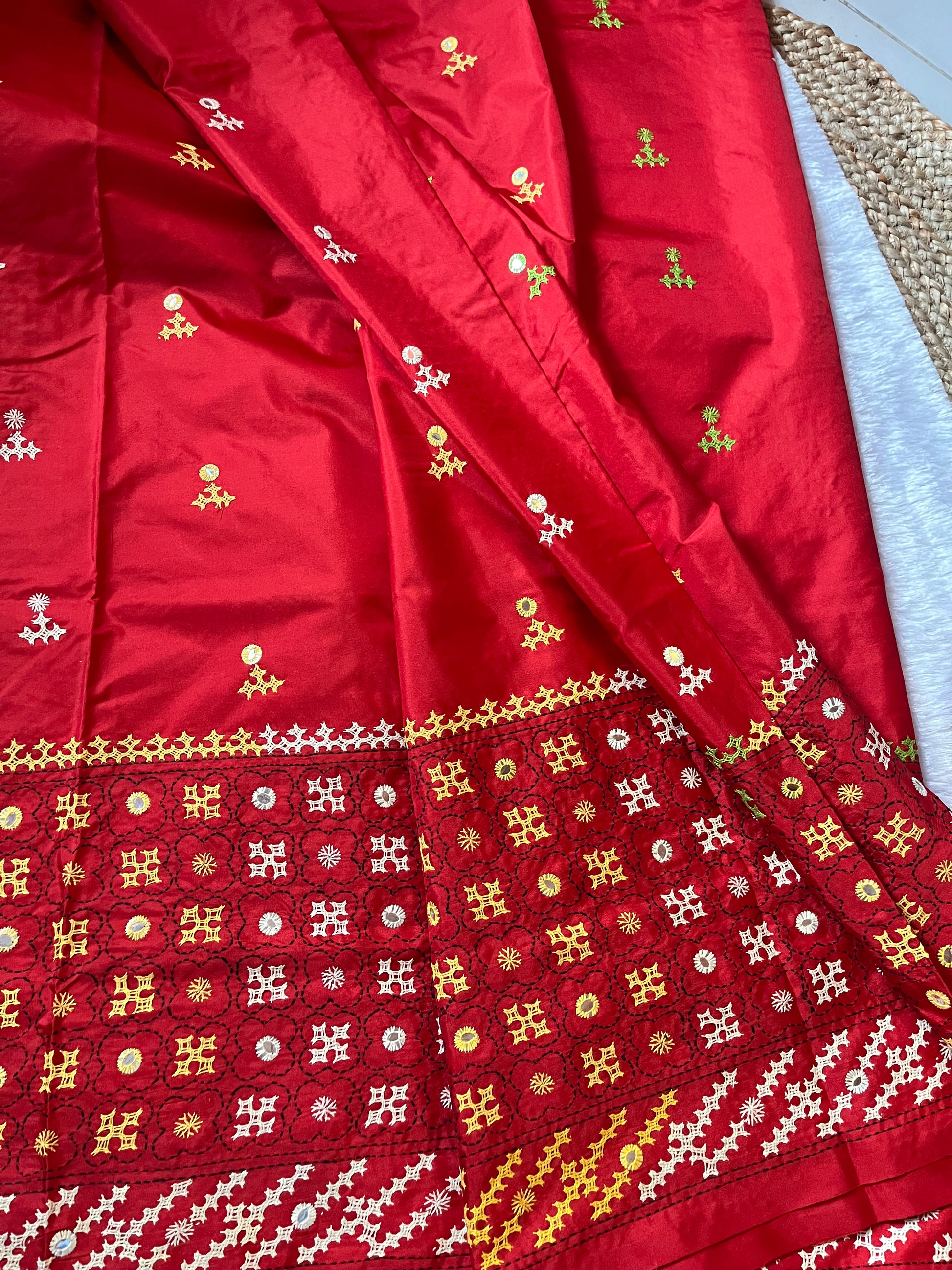 Detailed texture of Blended Bangalore silk with raised multi-color embroidery and hand-set mirrors