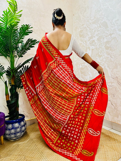 Red Gujarati Stitch Saree with green yellow white Kutch hand embroidery and mirror work by Desi Aadat