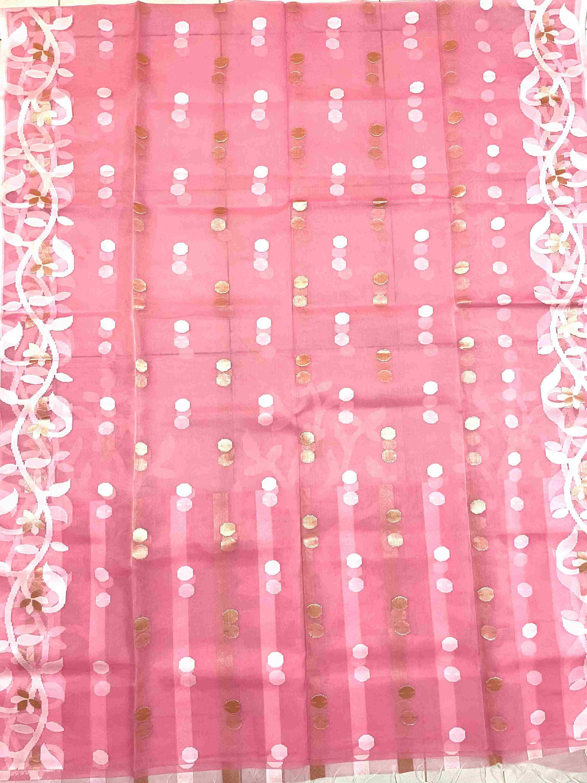 Graceful woman in Peach Pink handwoven saree showcasing Desi Aadat’s Jamdani artistry