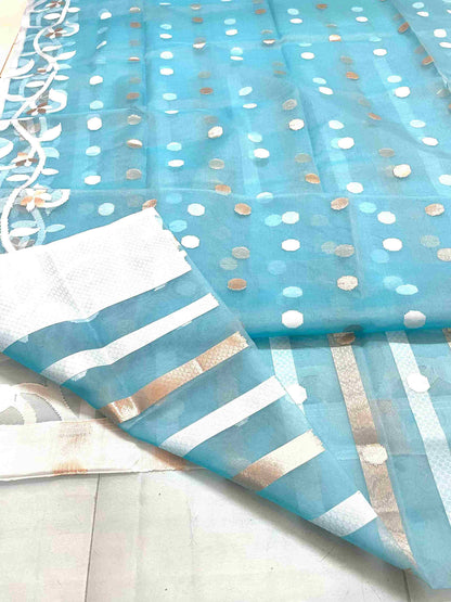 Elegant woman in Sky Blue handwoven saree showcasing Desi Aadat’s Jamdani design