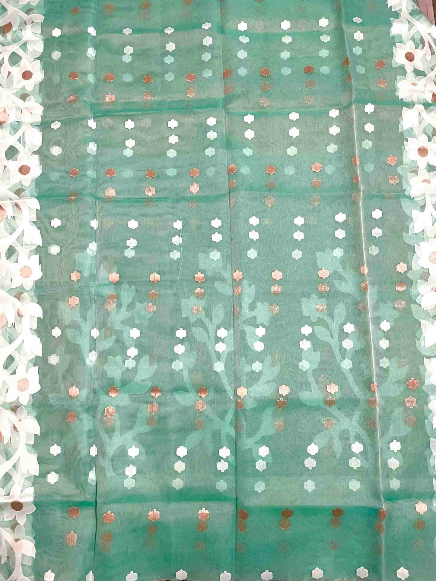 Graceful woman in Sea Green handwoven saree showcasing Desi Aadat’s Jamdani design