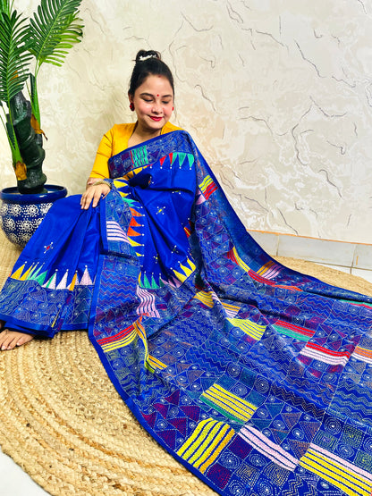 Sitting view of royal blue Kantha saree showing pennant flag pallu detail