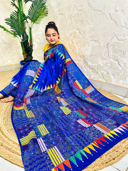 Sitting view of royal blue Kantha saree showing pennant flag pallu detail