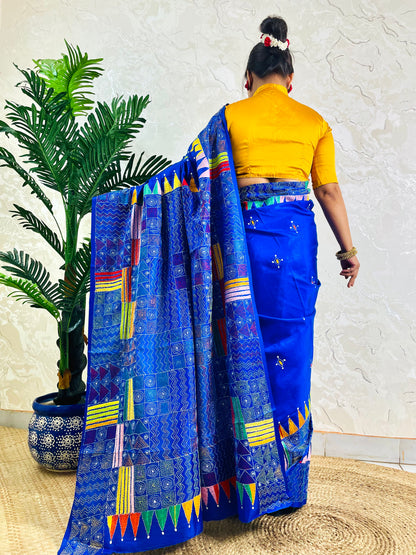 Back standing view of royal blue Kantha saree with pennant border pallu