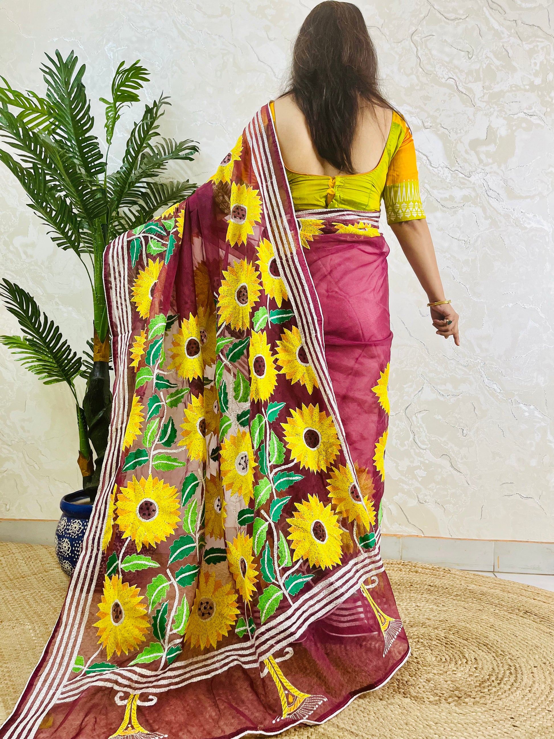 Handcrafted sunflower Kantha stitch saree in wine red, back pallu detail standing