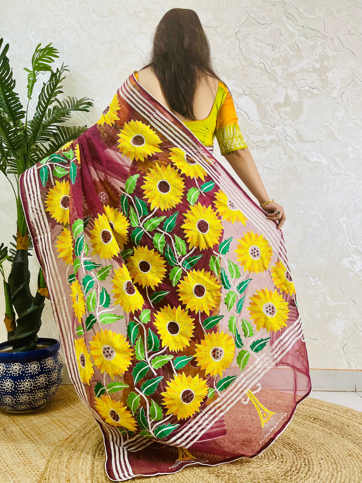 Handcrafted sunflower Kantha stitch saree in wine red, back pallu detail standing