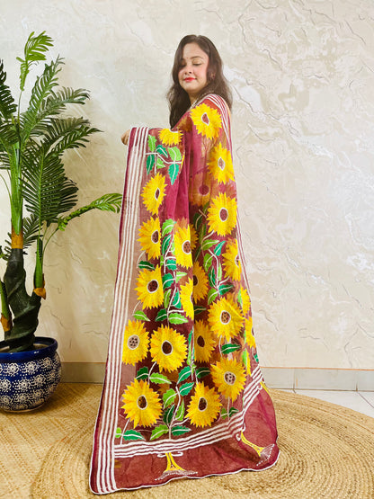 Wine red Kantha stitch organza saree with sunflower embroidery, front standing view