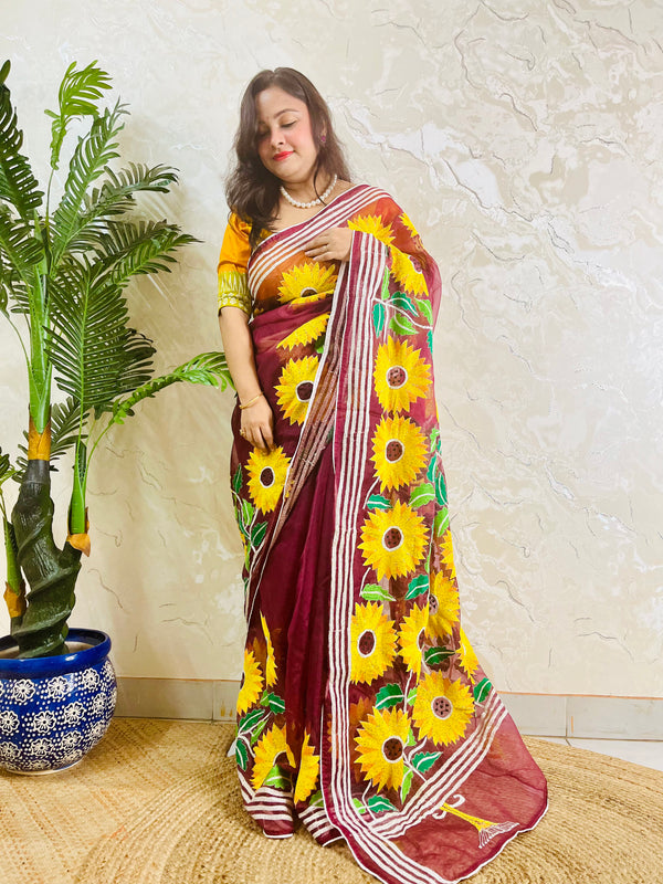 Wine red Kantha stitch organza saree with sunflower embroidery, front standing view