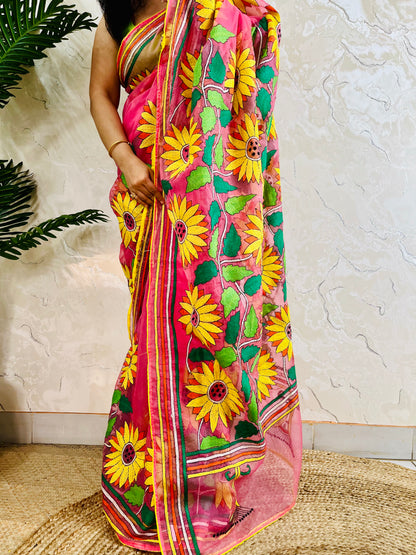 Close-up of hand-stitched Sunflower Kantha embroidery in mustard and green thread on baby pink organza saree – Desi Aadat