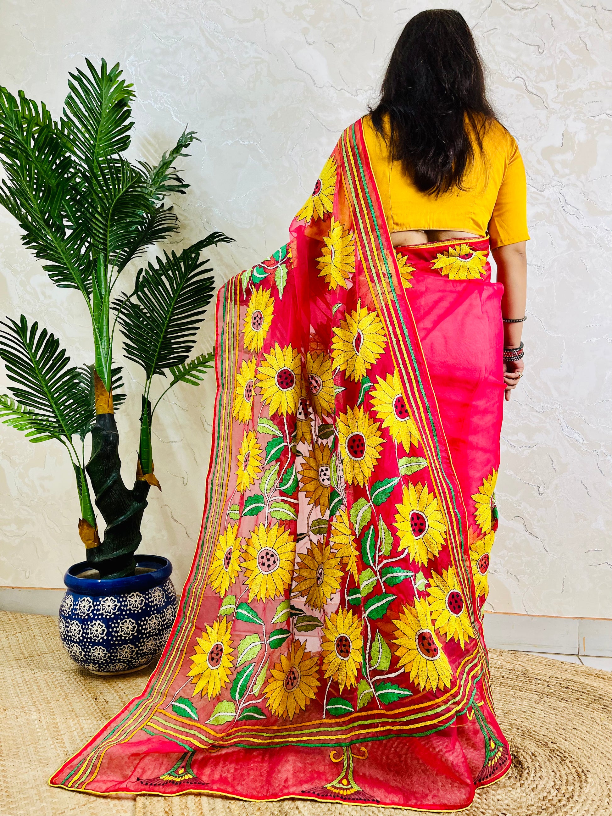 Crimson red Kantha stitch sunflower saree, back pallu standing view