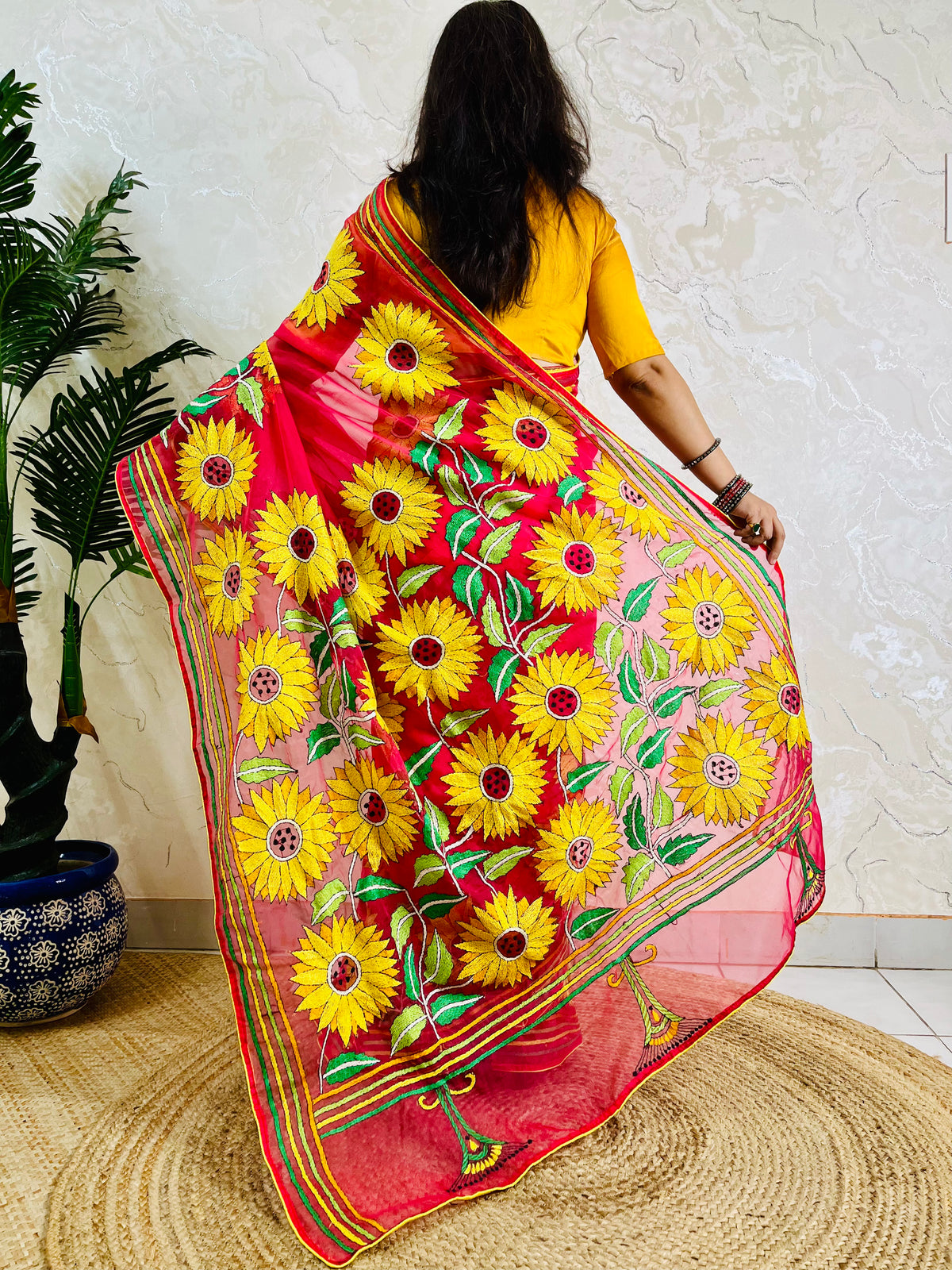 Crimson red Kantha stitch sunflower saree, back pallu standing view