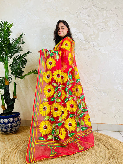 Front standing view of crimson red organza saree with sunflower embroidery