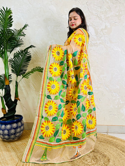 Woman standing in light peach sunflower Kantha stitch saree, side view