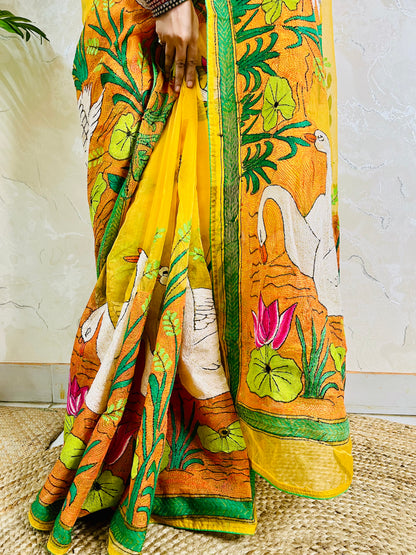 Close-up of hand-embroidered swan lotus Kantha stitch on sunshine yellow organza