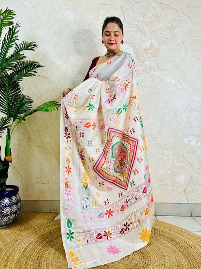 White handwoven saree draped standing pose with Kantha embroidery pallu detail