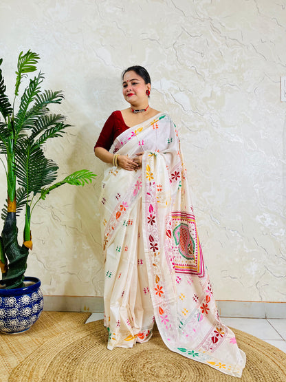 White handwoven saree draped standing pose with Kantha embroidery pallu detail