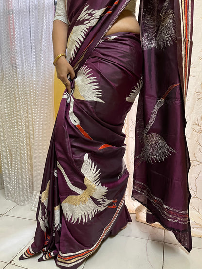 Beautiful woman wearing wine kantha stitch saree in traditional Indian styling