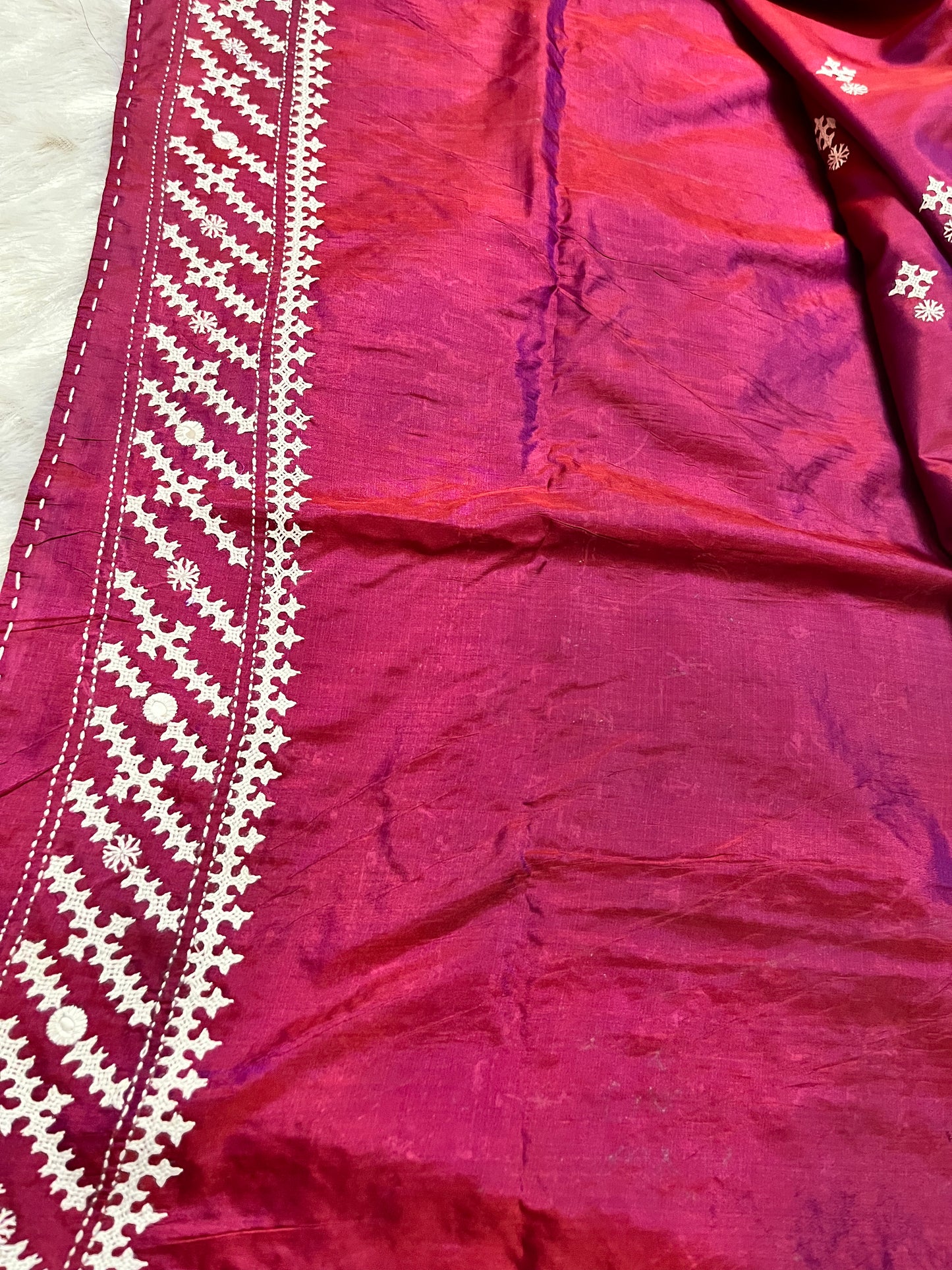 Matching wine red blouse piece with coordinating Gujarati geometric stitch and mirror details