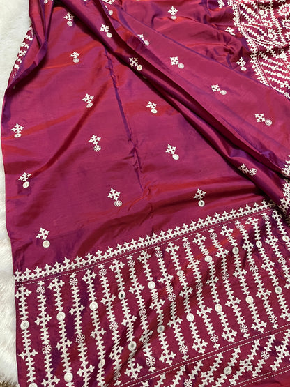 Detailed texture of handwoven Bangalore Silk with raised geometric embroidery and calculated mirror placement