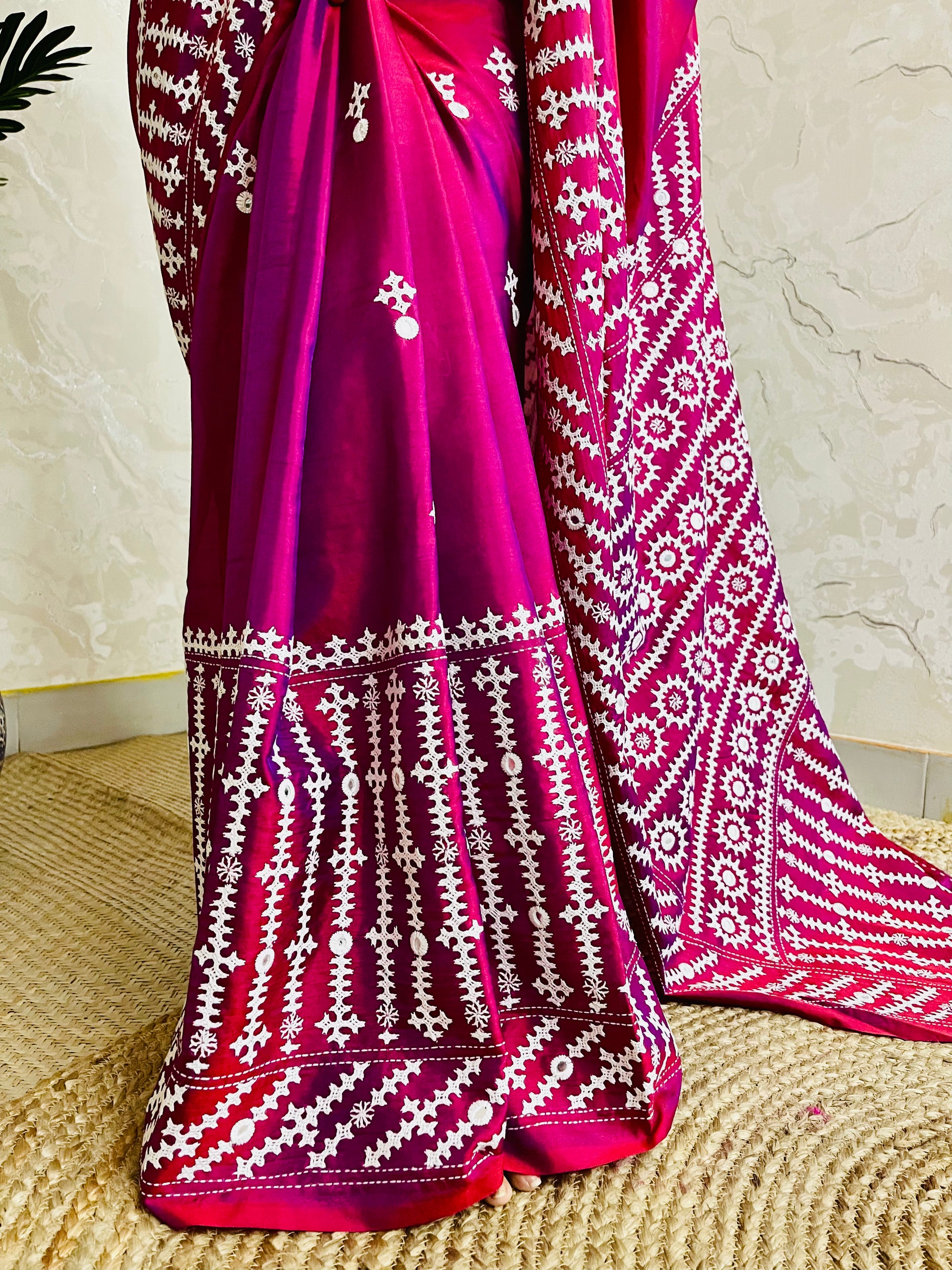 A women wearing Wine red Gujarati Stitch Saree with precise Kutch geometric hand embroidery and mirror work by Desi Aadat