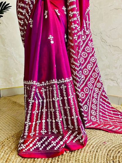 A women wearing Wine red Gujarati Stitch Saree with precise Kutch geometric hand embroidery and mirror work by Desi Aadat