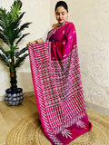 A women wearing Wine red Gujarati Stitch Saree with precise Kutch geometric hand embroidery and mirror work by Desi Aadat