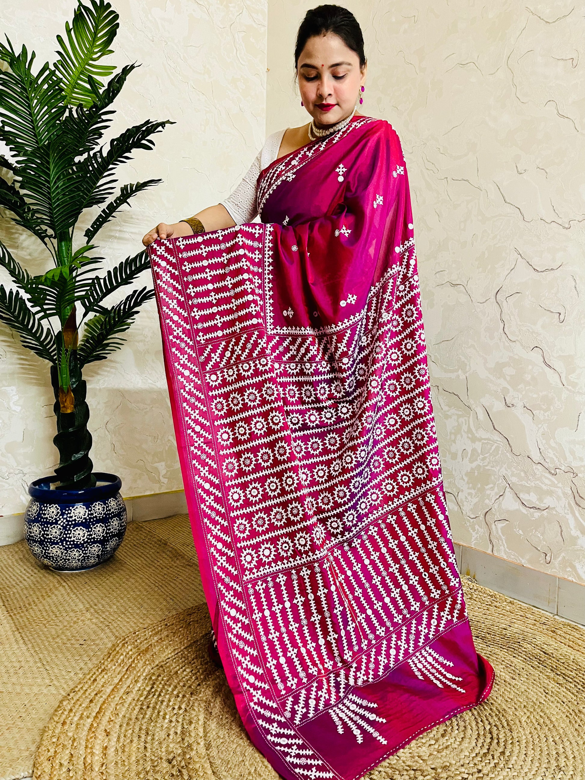 A women wearing Wine red Gujarati Stitch Saree with precise Kutch geometric hand embroidery and mirror work by Desi Aadat