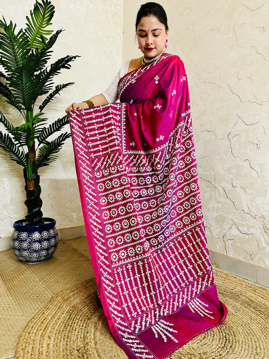 A women wearing Wine red Gujarati Stitch Saree with precise Kutch geometric hand embroidery and mirror work by Desi Aadat