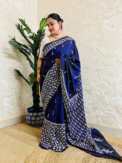 Model wearing a Violet Gujarati Stitch Saree with authentic Kutch hand embroidery and mirror work by Desi Aadat artisans