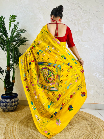 Back view of yellow Kantha saree with dancing figure motifs on Bangalore silk