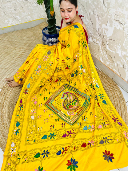 Yellow Kantha stitch saree with paisley pallu, full drape seated pose
